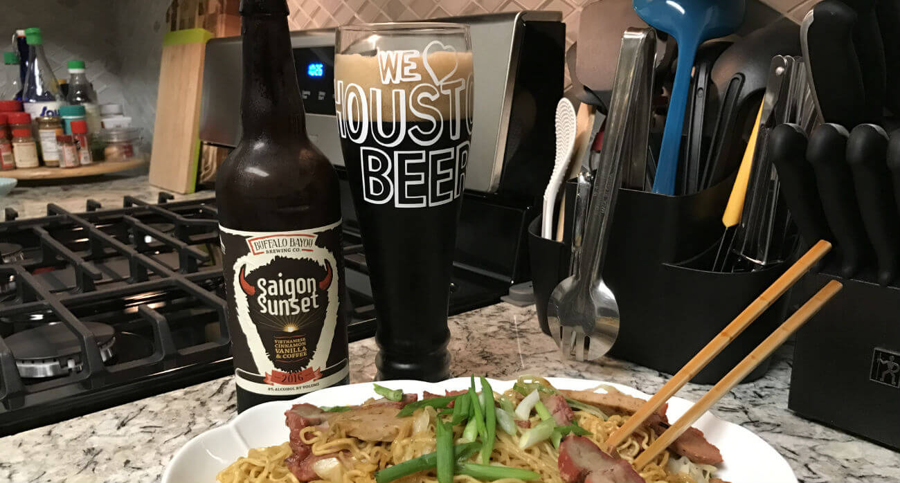 beer-chronicle-houston-craft-beer-review-saigon-sunset-beer-next-to-bottle-in-front-of-noodles